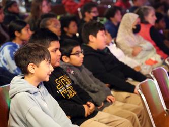 Close up of students watching the show